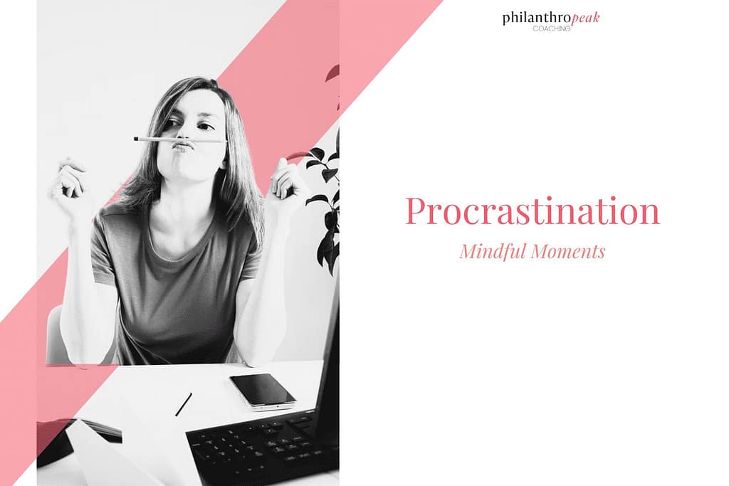 Woman contemplating procrastination at workspace desk