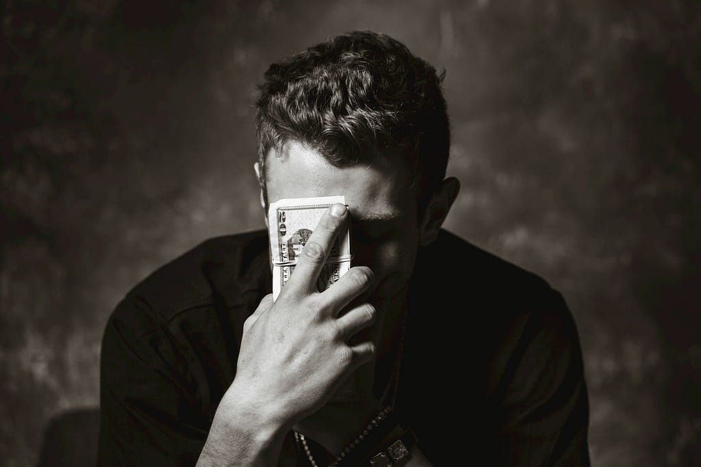 man holding banknote - ADHD Benefits UK