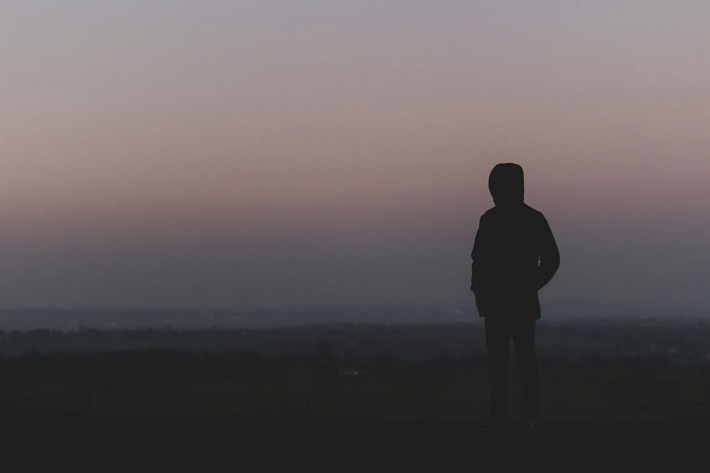 silhouette of man standing on hill during sunset ADHD Brain Fog