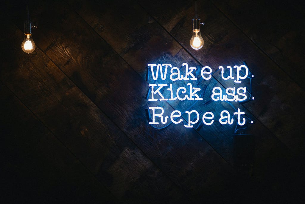 blue wake up kick ass repeat neon sign - adhd motivation tips