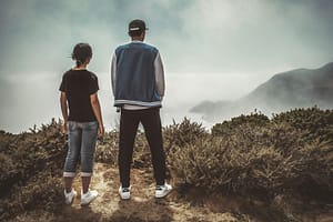 man and woman standing on mountain during day - ADHD in Women vs Men